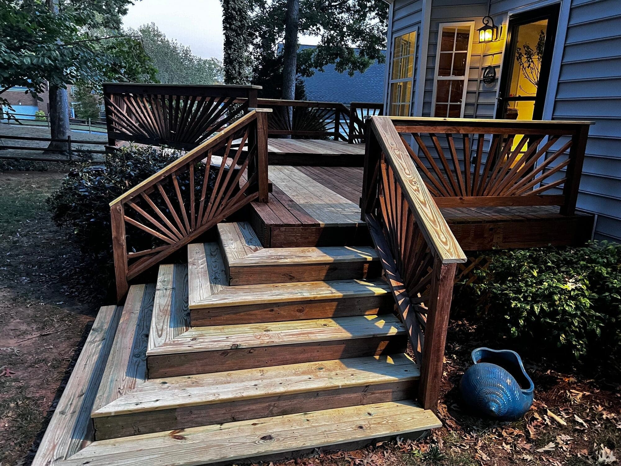 Custom deck with wide stairs and landscaped surround, Mint Hill NC
