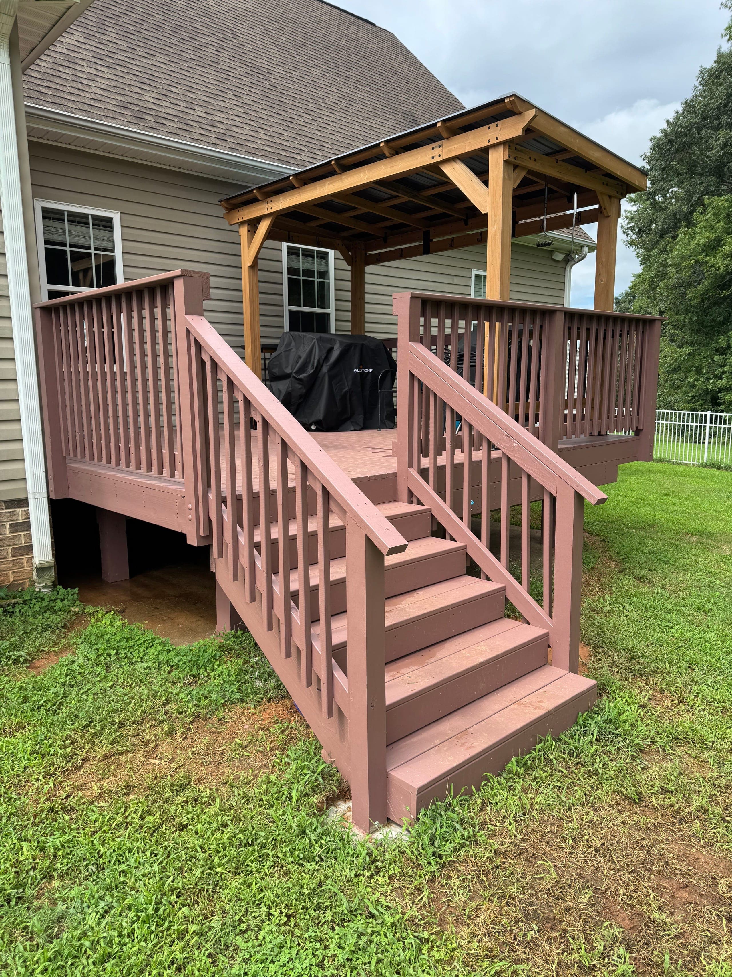 Cedar pavilion over a backyard deck with painted stairs and railing, Mint Hill NC