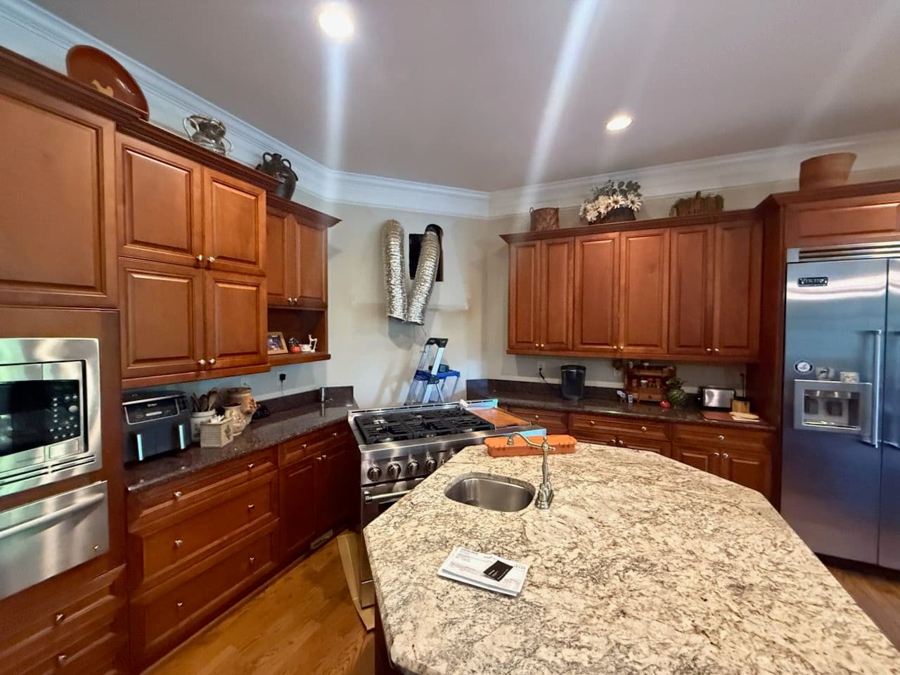 Gallery photos for Custom Kitchen Remodel Featuring Rich Wooden Cabinetry and Granite Countertops: Image #1